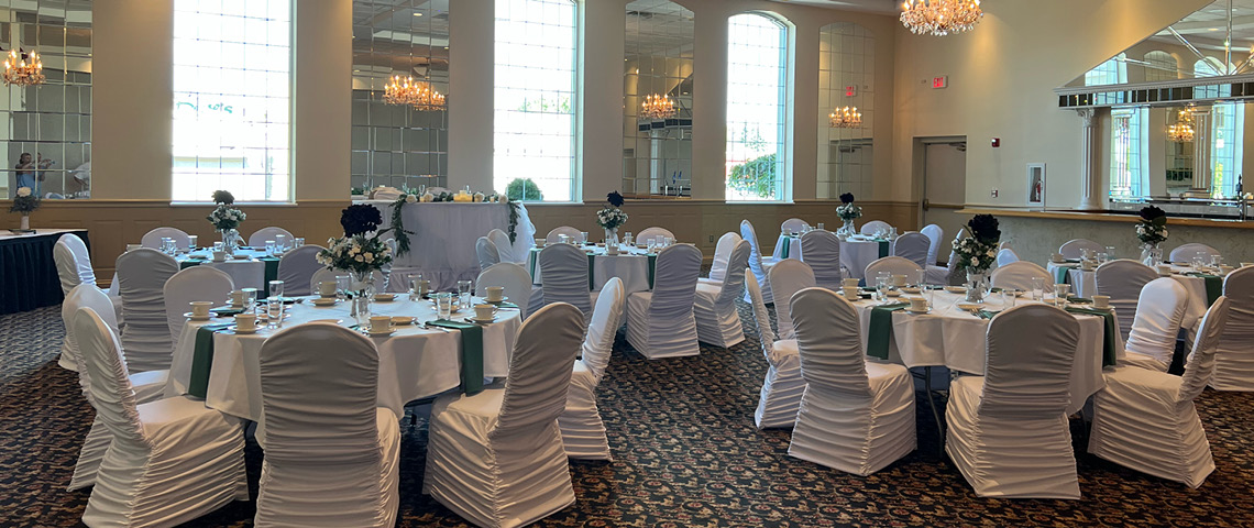 White and green linens in a banquet hall for a wedding